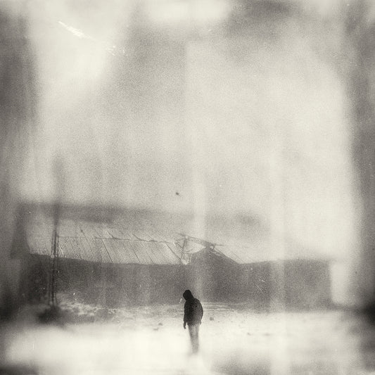 Man Standing Before Abandoned House in Snowfall  - Fineart archival print, wallart