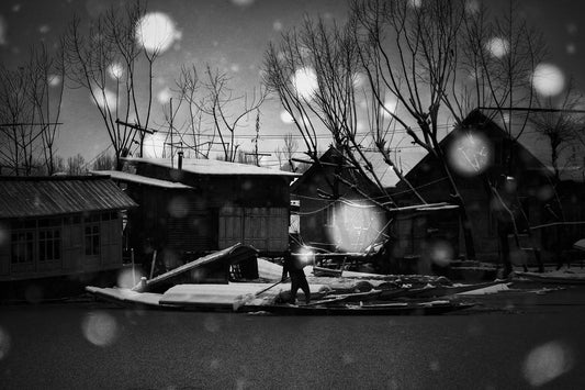 Boatman in Snowfall on Dal Lake as Darkness Descends - Fineart archival print, wallart