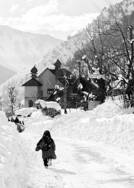 Little girl running in the snow, Kashmir